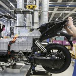 A mechanic makes technical check on BMW C evolution electric maxi-scooter at the BMW motorcycle plant in Berlin