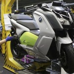 A mechanic makes check on BMW C evolution electric maxi-scooter at BMW motorcycle plant in Berlin